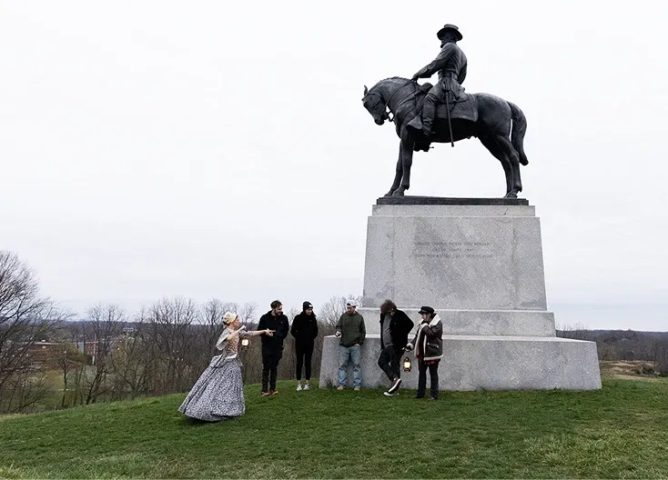 Horse Statue with a group of tour-goers at the base